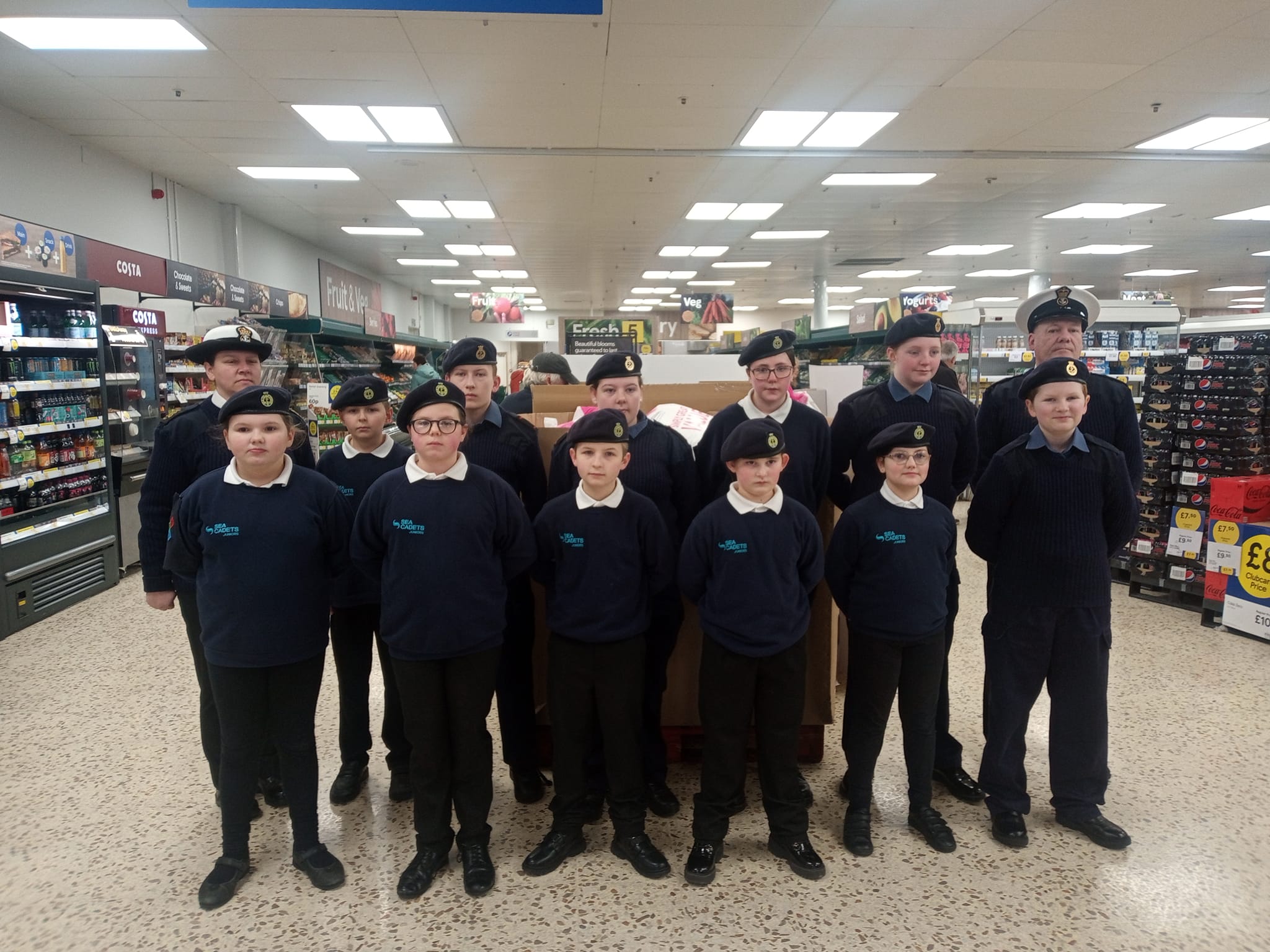 Sea Cadets standing at ease in Tesco store