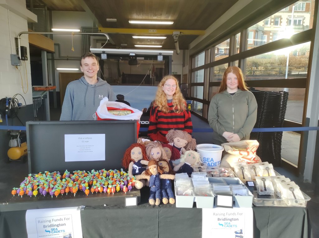 Three cadets brave the elements outside in December.