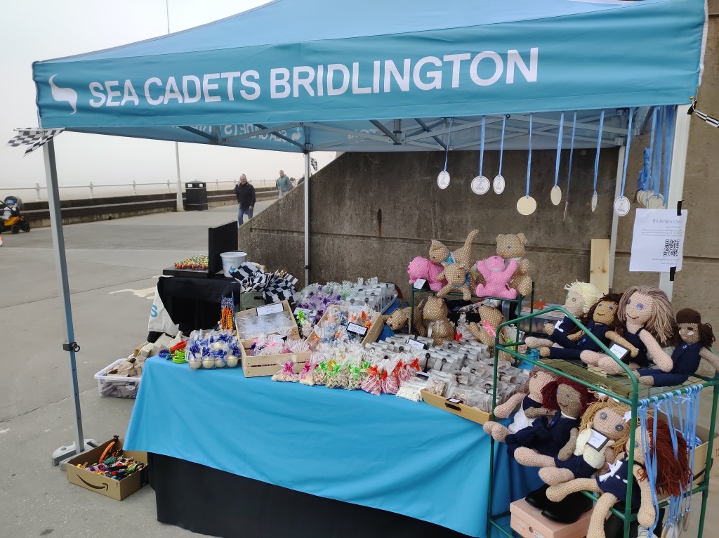 The Sea Cadets Gazebo full of home made toys, bracelets, cakes and sweets.