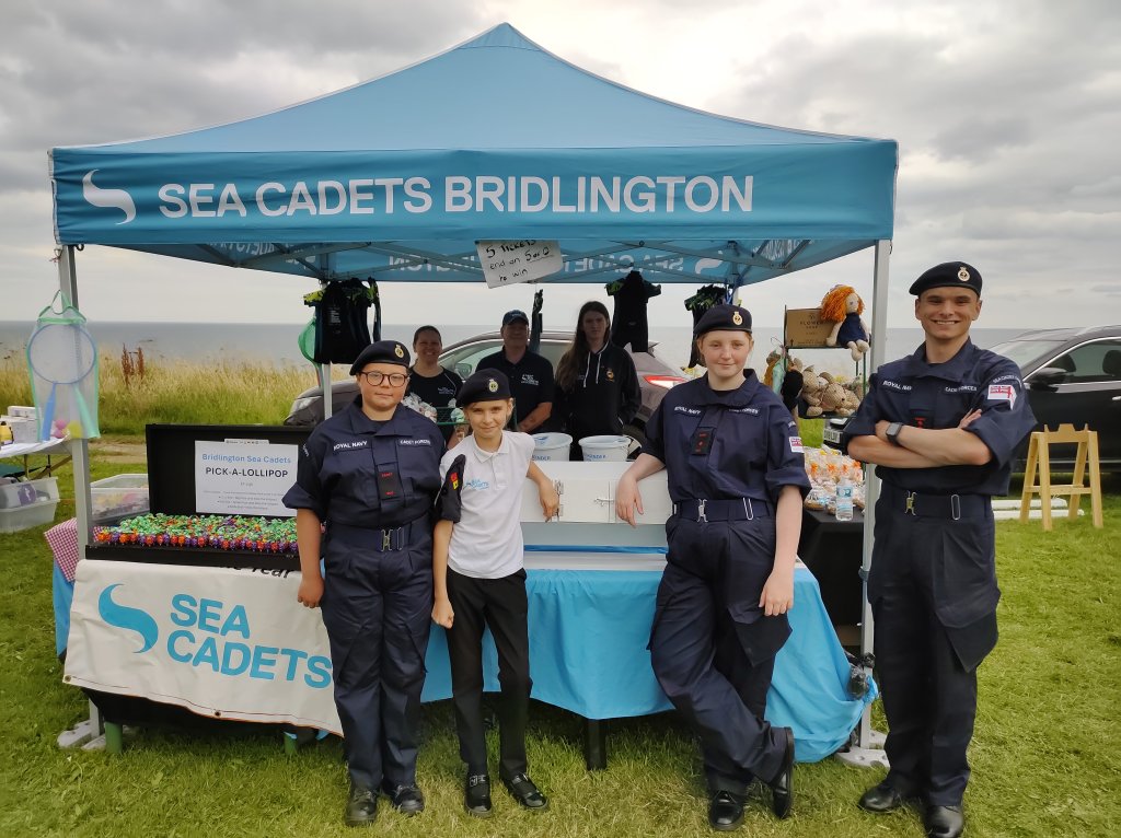 Photograph of our Sea Cadets helping with the Tombola at our fundraising stall at the Bridlington Lions Carnival.