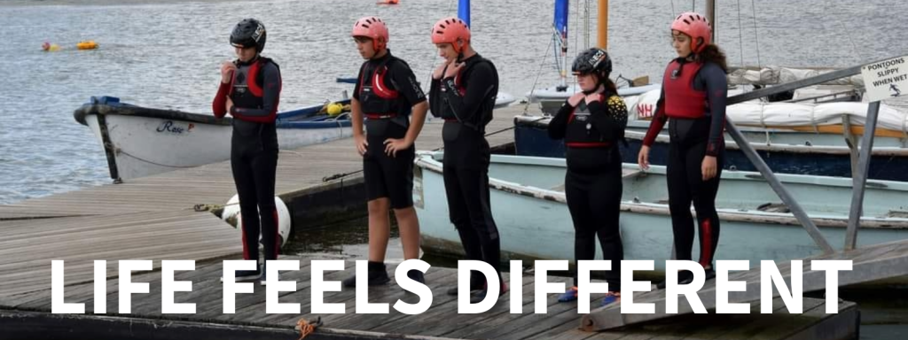 Photograph of cadets in wetsuits with the words Life feels different